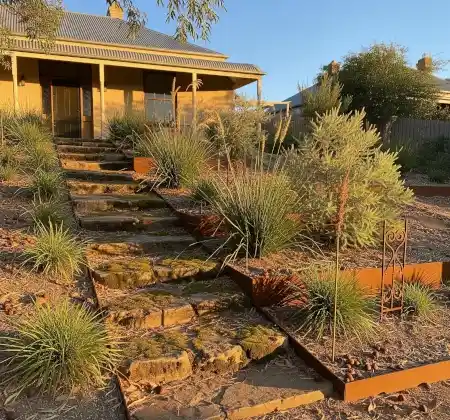 Stone steps on a tight sloping front yard